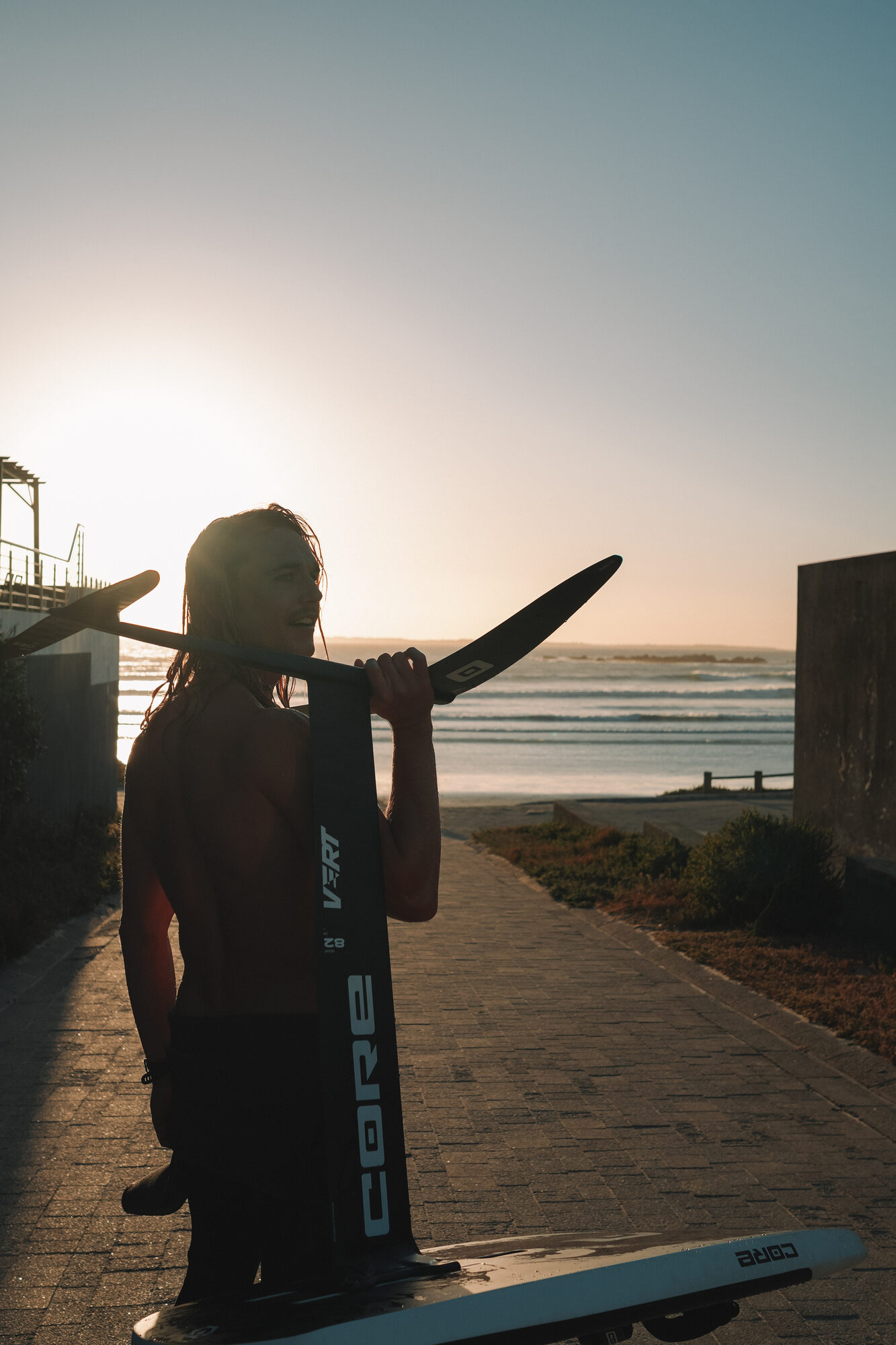 A personality-led Big Bay waterman story with portraits, place, and session details.