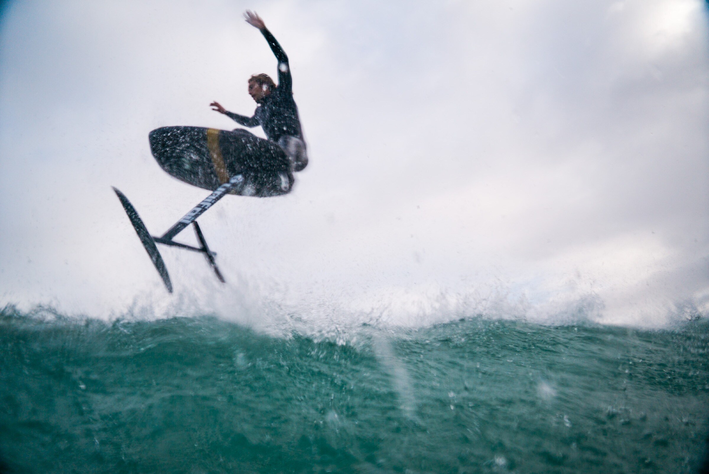 Golden-hour foiling silhouette from Dylan Wichmann’s water archive.