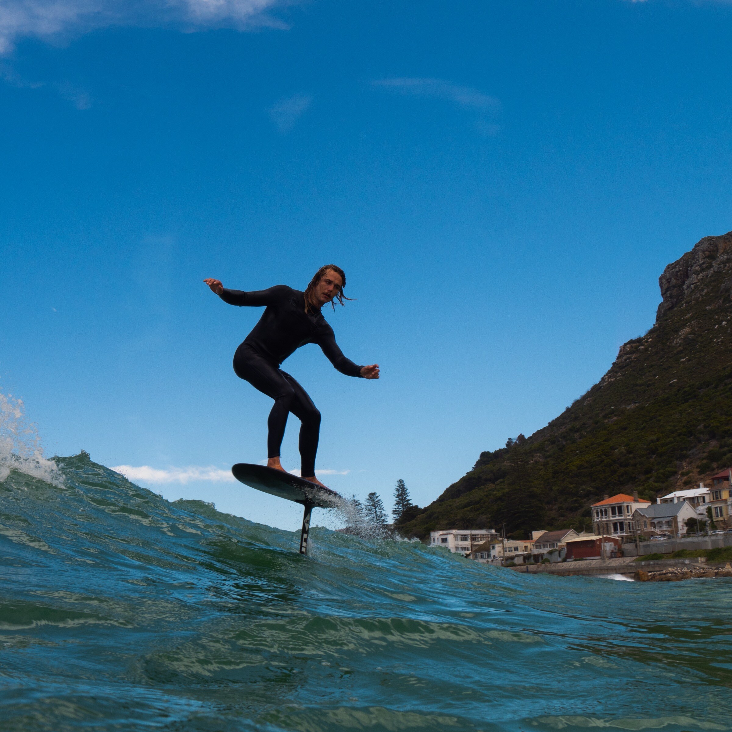 Foiling action against a Cape mountain backdrop.