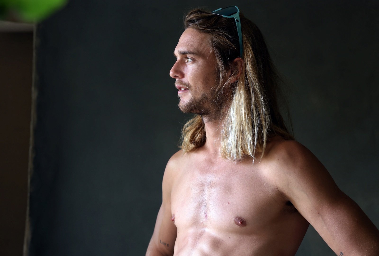 Lifestyle portrait of Dylan Wichmann in natural light near the water.